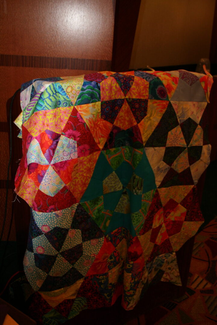 Colorful patchwork quilt with geometric patterns.