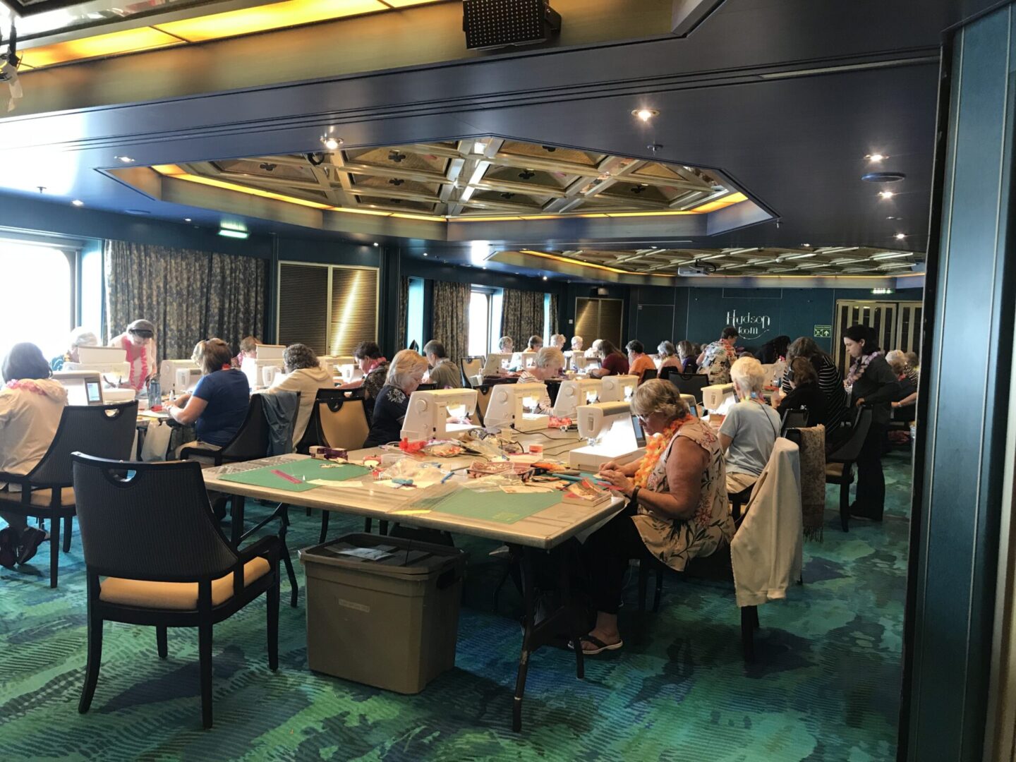 People crafting in a workshop room.