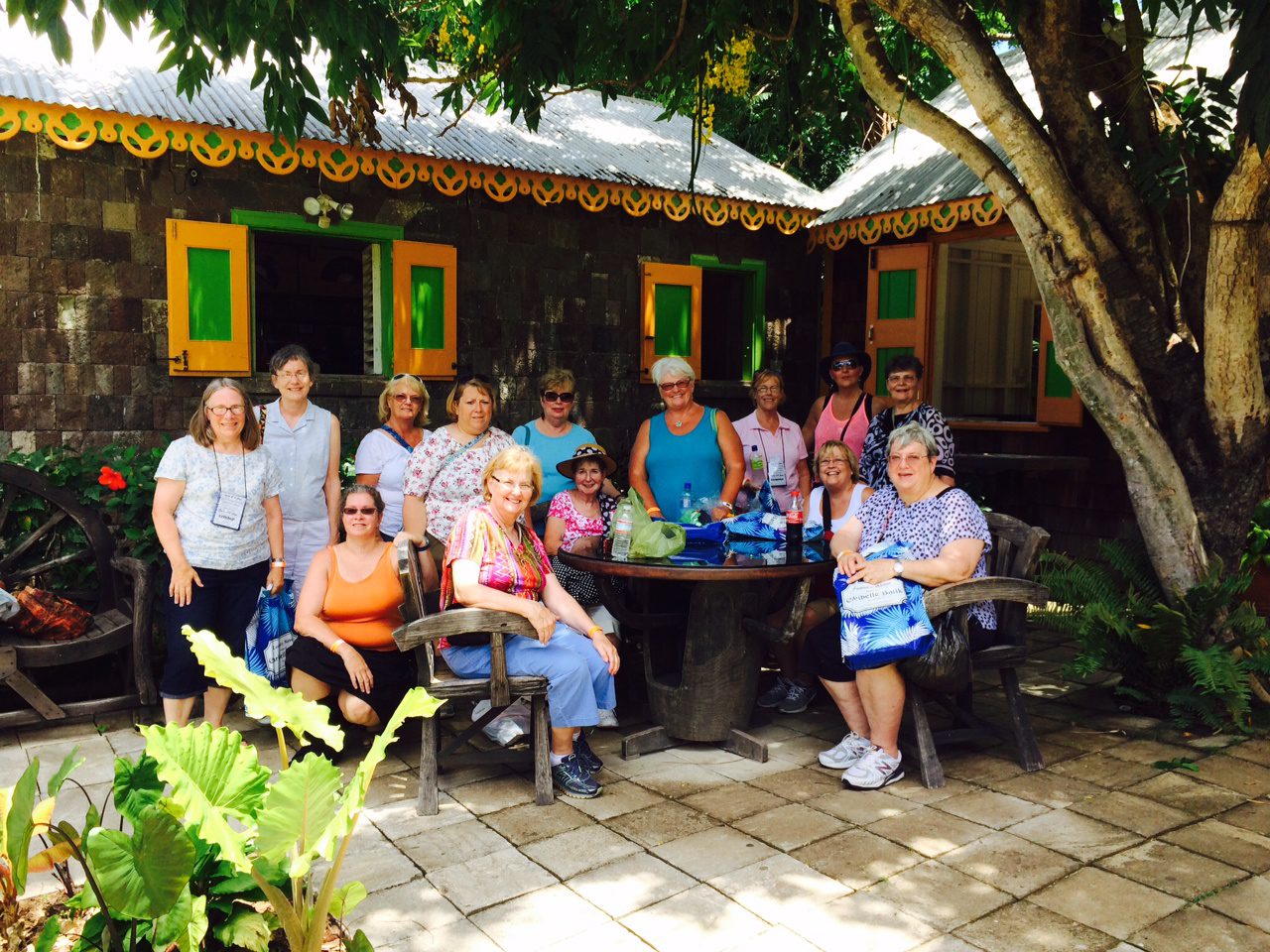 Group of people posing outside a building.