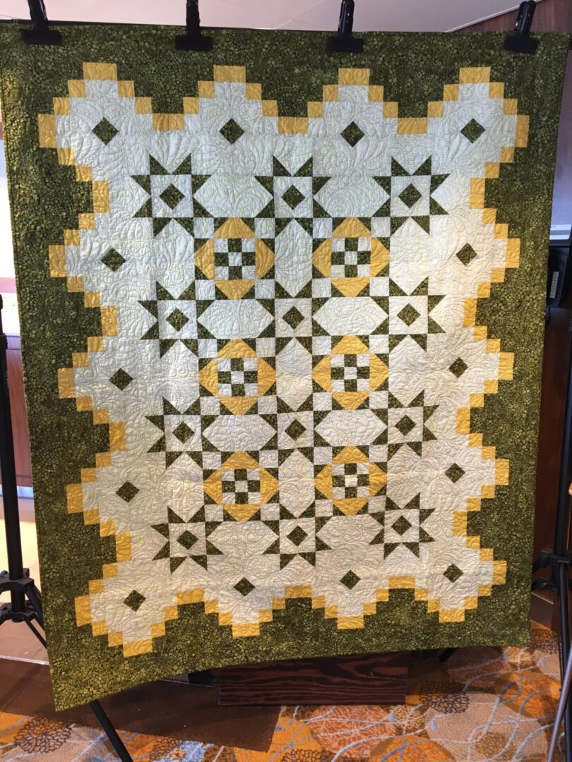 Patchwork quilt with geometric star patterns.