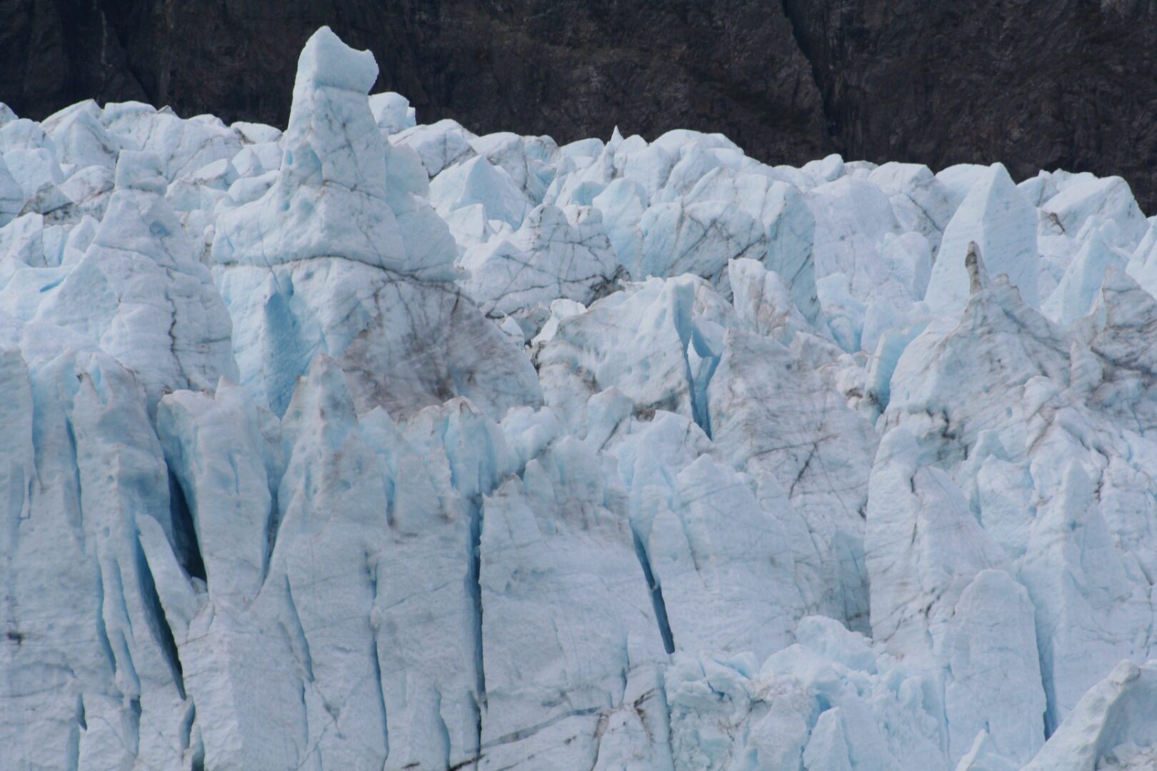 Jagged icy glacier with rugged surface.