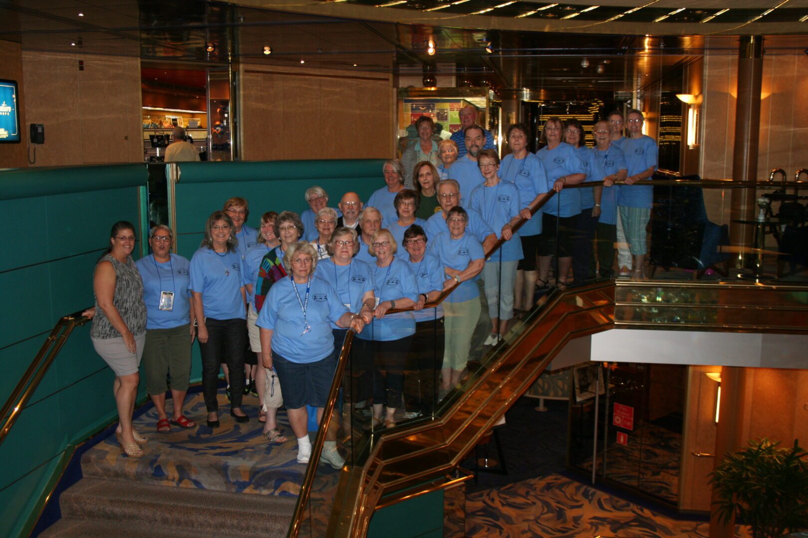 Group of people posing on staircase.